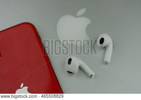Bangkok, Thailand - November 15, 2022 : Apple Airpods 3 Next To Iphone 11 Product Red Model Placed O