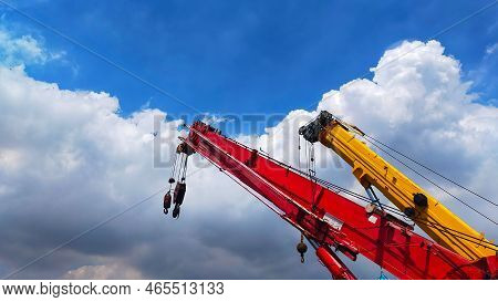 Beautiful Red And Yellow Telescopic Crane With Blue Sky With Cloud For Background.