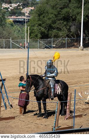 Folsom, Ca, September 24, 2022. Armored Knight On Black Horse At The Folsom Renaissance Faire. This 