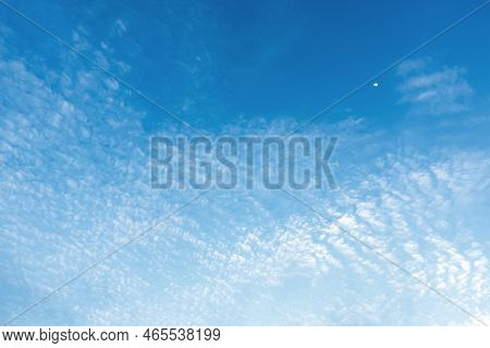 Half Moon In Sky In Daytime With Wispy Clouds Environment Atmosphere. Natural Moon And Sky Backgroun
