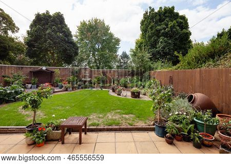 Newmarket, Suffolk, England - August 21 2018: Suburban Mews Landscaped House Garden With Patio And L