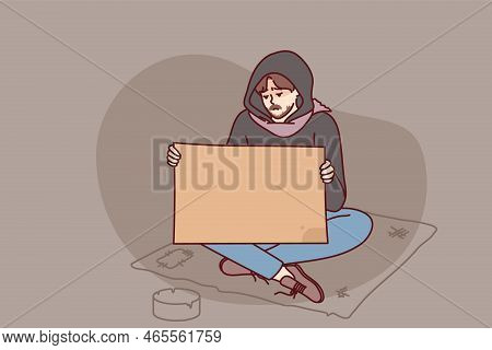 Poor Man Begging On Street Holding Mockup Board Or Paper. Unhappy Male Beggar Suffer From Poverty Wi