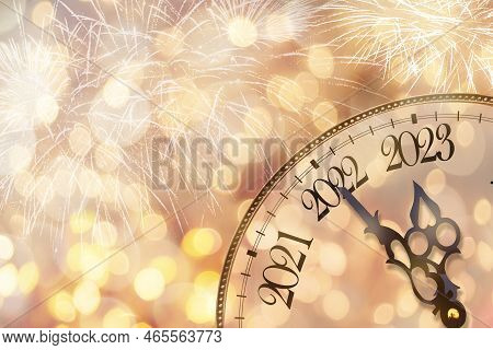 Clock Face On A Christmas Background. The Year 2023 Is Coming Soon. The Concept Of The New Year.