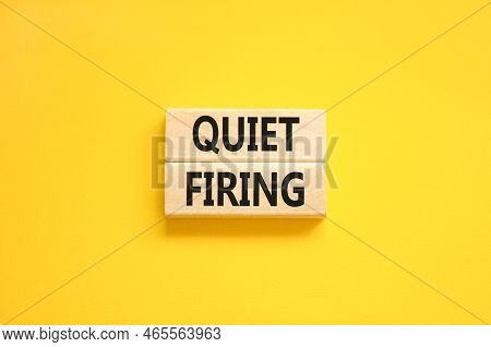 Quiet Firing Symbol. Concept Words Quiet Firing On Wooden Blocks. Beautiful Yellow Table Yellow Back