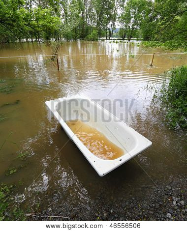 Flooded landscape with lost bathtub. Radbuza river, Pilsen city, Czech republic, Europe.