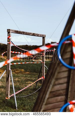 Hazard Tape Covering Wooden Playground In Field
