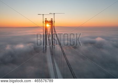 Panoramic Aerial Drone View From Above Of The Suspended Bridge Over Danube River, Under Construction