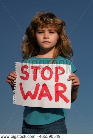 Protest Against War. Portrait Blond Little Boy Calls To Stop War, Raises Banner With Inscription Sto