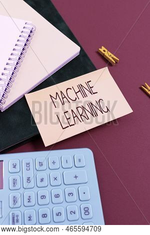 Hand Writing Sign Machine Learning. Business Idea The Concept That A Computer Can Learn New Data Its