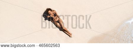 Top Aerial Drone View Of Woman In Swimsuit Relaxing And Sunbathing On Beach White Sand Near The Ocea