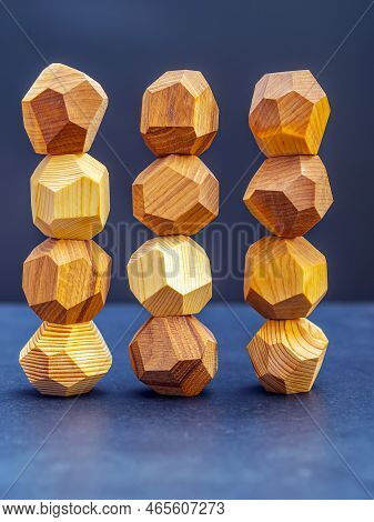 Tumi Ishi Wood Rocks On The Dark Background. Close-up