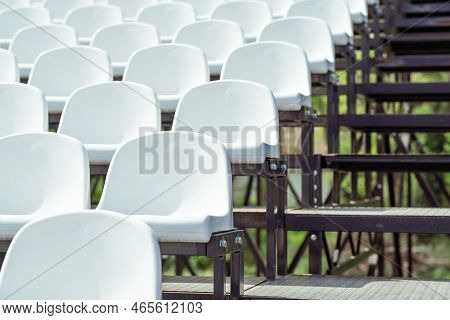 Seats Of Tribune On Sport Stadium. Concept Of Fans, Chairs For Audience, Cultural Environment Concep