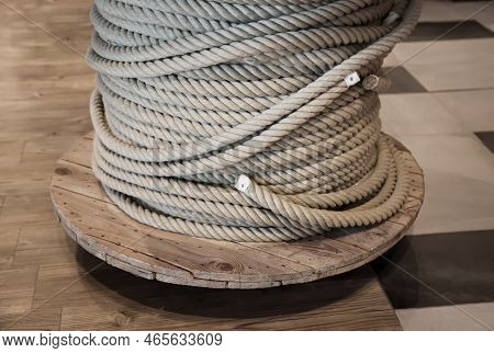 A Drum With A Coiled, Wound Rope, A Rope.