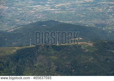 Hornisgrinde, Germany, July 8, 2022 Radio Tower On The Top Of A Green Hill Seen From A Small Plane
