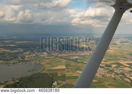Gunzenhausen, Bavaria, Germany, July 9, 2022 Flight Abeam The City In A Small Plane