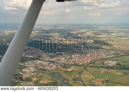 Gunzenhausen, Bavaria, Germany, July 9, 2022 Flight Abeam The City In A Small Plane