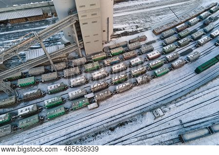 Aerial View Of Cargo Train Cars Loaded With Construction Goods At Mining Factory. Railway Transporta