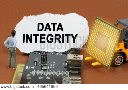 Computer Concept. On The Board With Microcircuits Lies A Paper Plate With The Inscription - Data Int