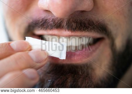 Man Chewing Wet Moist Nicotine Tobacco Snus Product