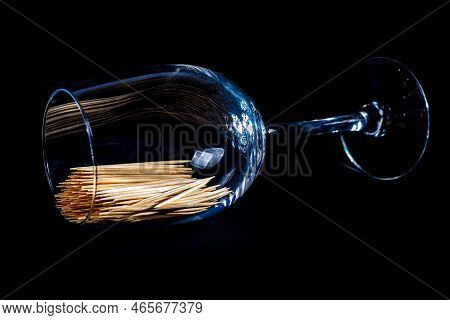 Bamboo Wooden Toothpicks In Glass Jar, Wine Glass. In Bucket. Toothpicks On Black Background. Front