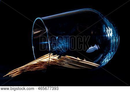 Bamboo Wooden Toothpicks In Glass Jar, Wine Glass. In Bucket. Toothpicks On Black Background. Front