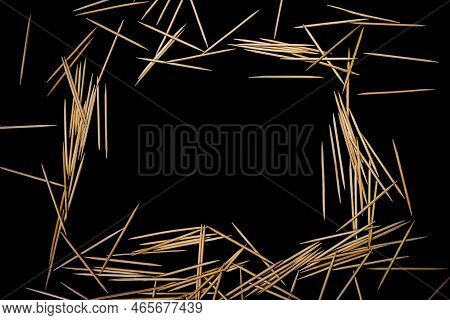 Bamboo Wooden Toothpicks In Glass Jar, Wine Glass. In Bucket. Toothpicks On Black Background. Front