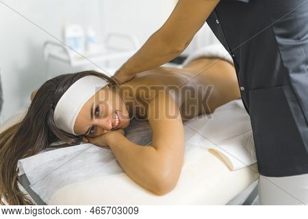 It Is Time To Take Care Of Myself, Charming Latin Girl Having A Body Massage At The Spa. High Qualit