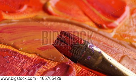 Brush On Artist's Palette With Mixed Paints, Closeup