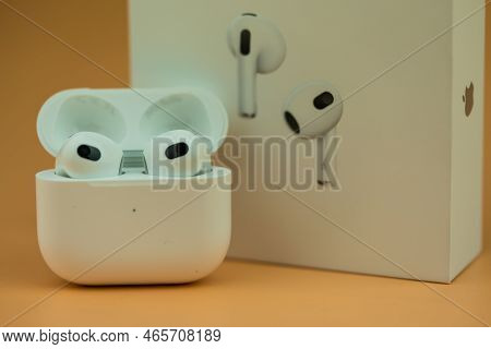 Bangkok, Thailand - November 19, 2022 : The Charging Case Next To New Apple Computers Airpods 3 Blue
