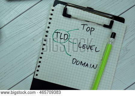 Concept Of Tld - Top Level Domain Write On Paperwork Isolated On Wooden Table.