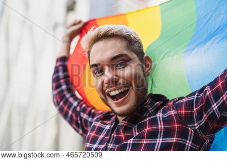 Happy Gay Man Celebrating The Pride Festival With The Lgbtq Rainbow Flag