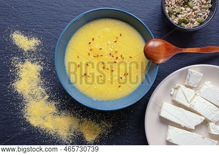 Healthy Breakfast. Cornmeal Porridge In Bowl. Different Seeds And Cheese