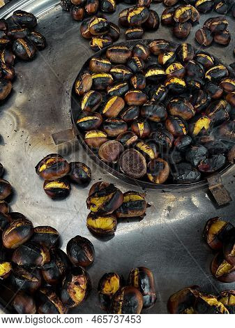 Fried Chestnuts On The Street. Street Food. Roasted Chestnuts