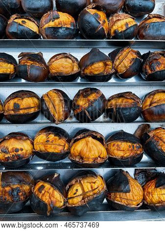 Delicious Grilled Chestnuts As Background. Hot, Fresh