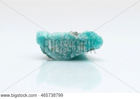 Natural Amazonite Gemstone Isolated On White Background. A Bluish-green Crystal On A White Backgroun
