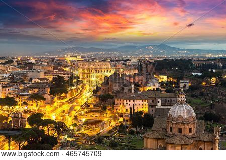 Panoramic Aerial View Of Colosseum In A Summer Night In Rome, Italy