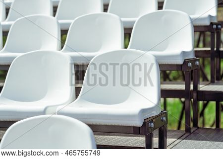 Seats Of Tribune On Sport Stadium. Concept Of Fans, Chairs For Audience, Cultural Environment Concep