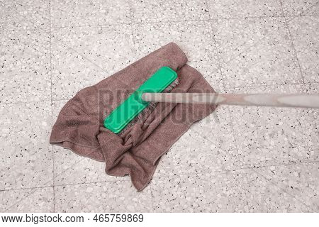 Cleaning Of Tiled Floor With Floorcloth To Mean A Concept