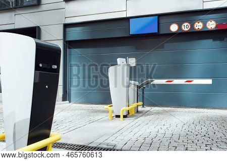 Parking Meters On City Street Near Buildings