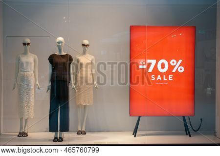 Siedlce, Poland - July 26, 2022: Sale Sign On Red Stand In Showcase At Shopping Mall. Seasonal Disco