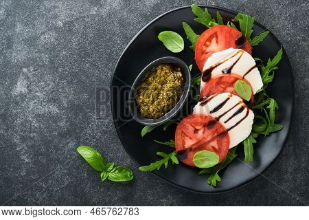 Caprese Salad. Italian Caprese Salad With Sliced Tomatoes, Mozzarella Cheese, Arugula, Basil, Olive 