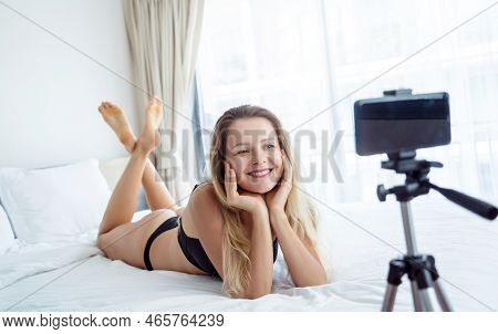 Young Sexy Woman Posing In Front Of Camera And Working As Webcam Model