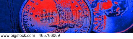 American Coins Close Up Lie On Dark Surface Of Office Table. Soaring Eagle Sacagawea Dollar Coin. Br