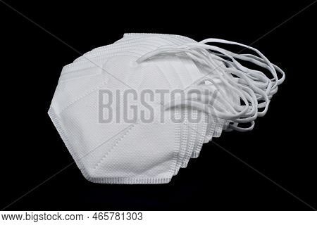 Disposable Kn-95 Masks Or White Colored New Medical Masks. Covid-19 Prevention. H1n1, H5n1 Safety Me