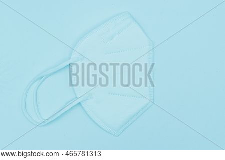 Disposable Kn-95 Mask Or Light Blue Colored New Medical Mask. Covid-19 Prevention. H1n1, H5n1 Safety