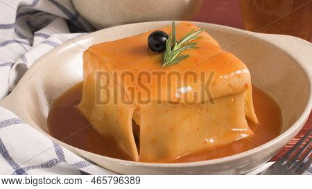 Traditional Portuguese Snack Food. Francesinha Sandwich Of Bread, Cheese, Pork, Ham, Sausages, With 