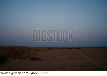 Moon Set. View Of Thar Desert Sand Dunes , Pre Dawn Light Before Sun Rise And Moon Setting Off In Th