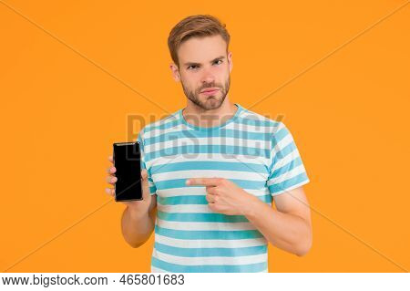 Download And Start Play. Man Pointing At Smartphone. Pointing Gesture. Index Finger Pointing. Pointi