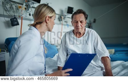Young Woman Doctor Explaining Diagnosis To Her Patient.