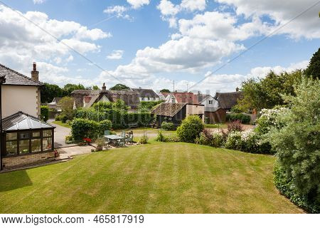 Foxton, Cambridgeshire - June 21 2018: Rooftop View Of Landscaped Village Gardens With Lawn And That